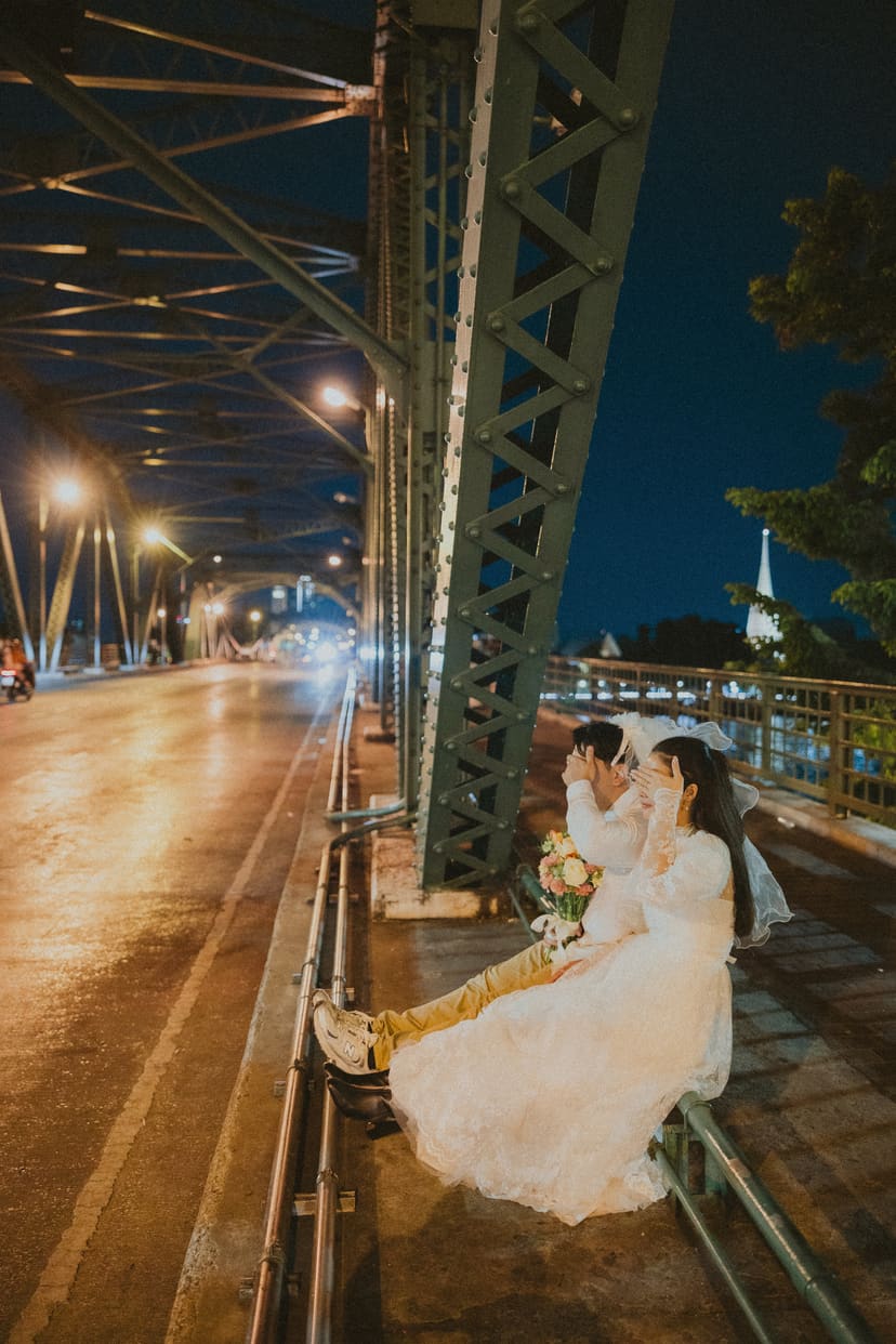 Night under a bridge, lights drawn into long lines