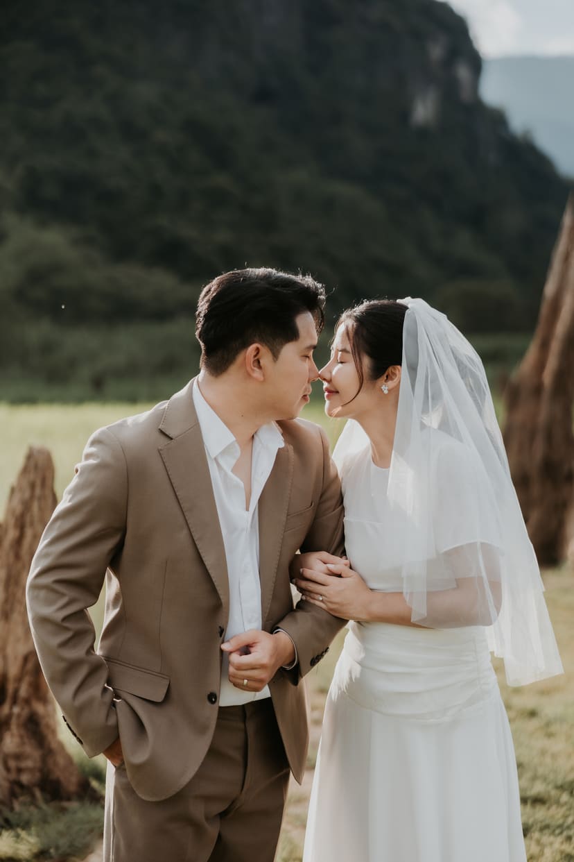 The couple in a meadow under the cliff