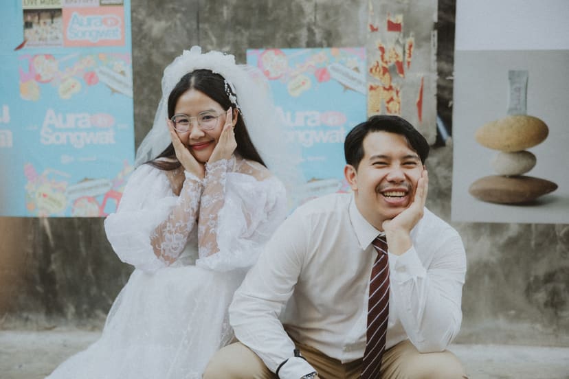 The couple close together in a Songwat alley