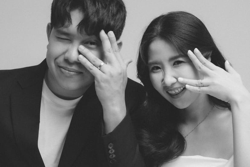 The couple laughing in the studio